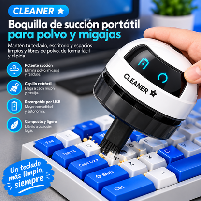 Mini aspiradora portátil con cepillo retráctil limpiando las migas de un teclado